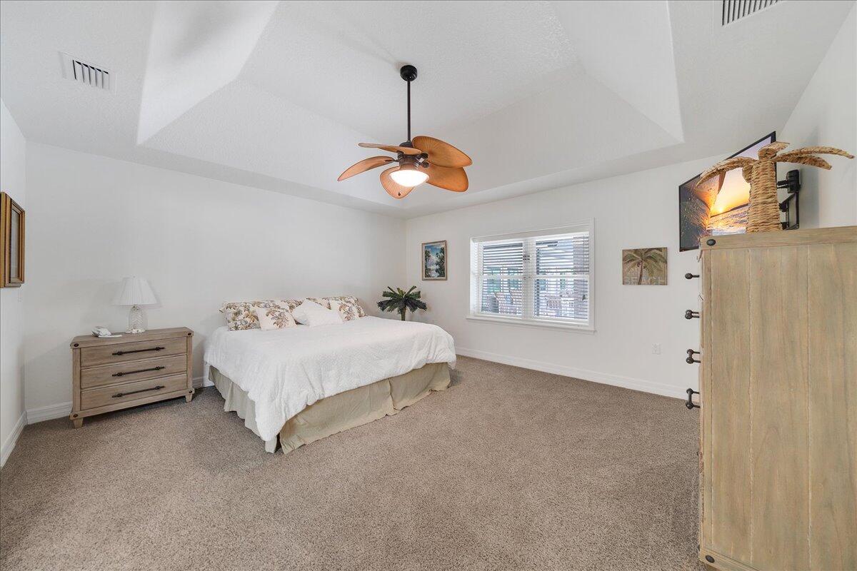 3125 Davis Road Mims, FL 32754 - Photo 31 of 46 a spacious bedroom with a bed and a window