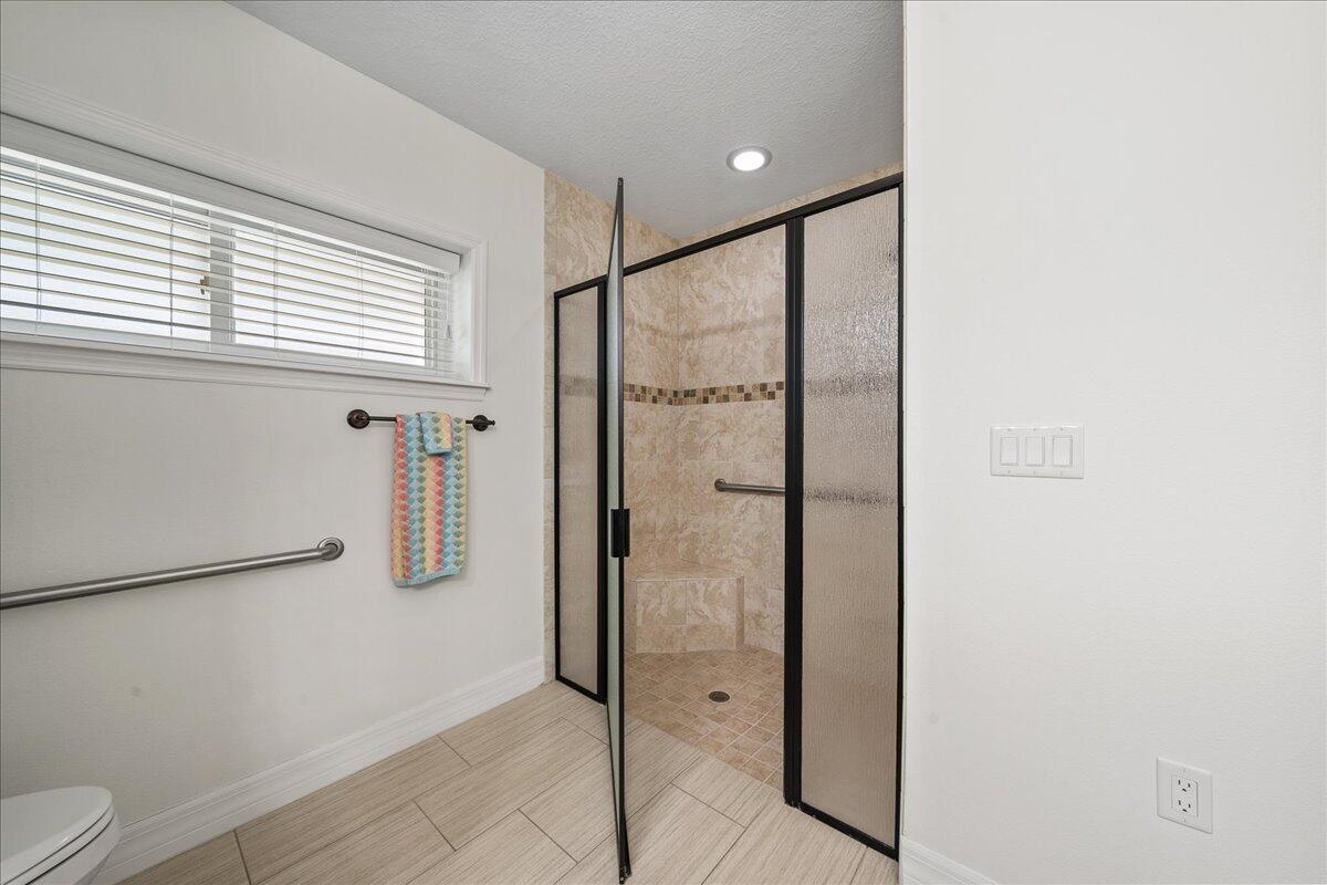 3125 Davis Road Mims, FL 32754 - Photo 34 of 46 a bathroom with a shower and a toilet