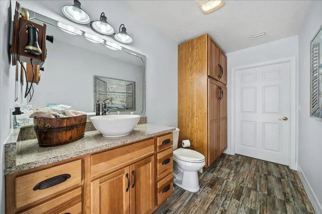 a view of bathroom with a sink and mirror