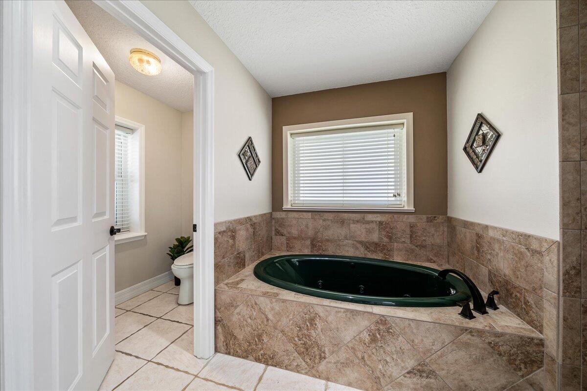 3125 Davis Road Mims, FL 32754 - Photo 10 of 46 a bathroom with a sink and a bathtub