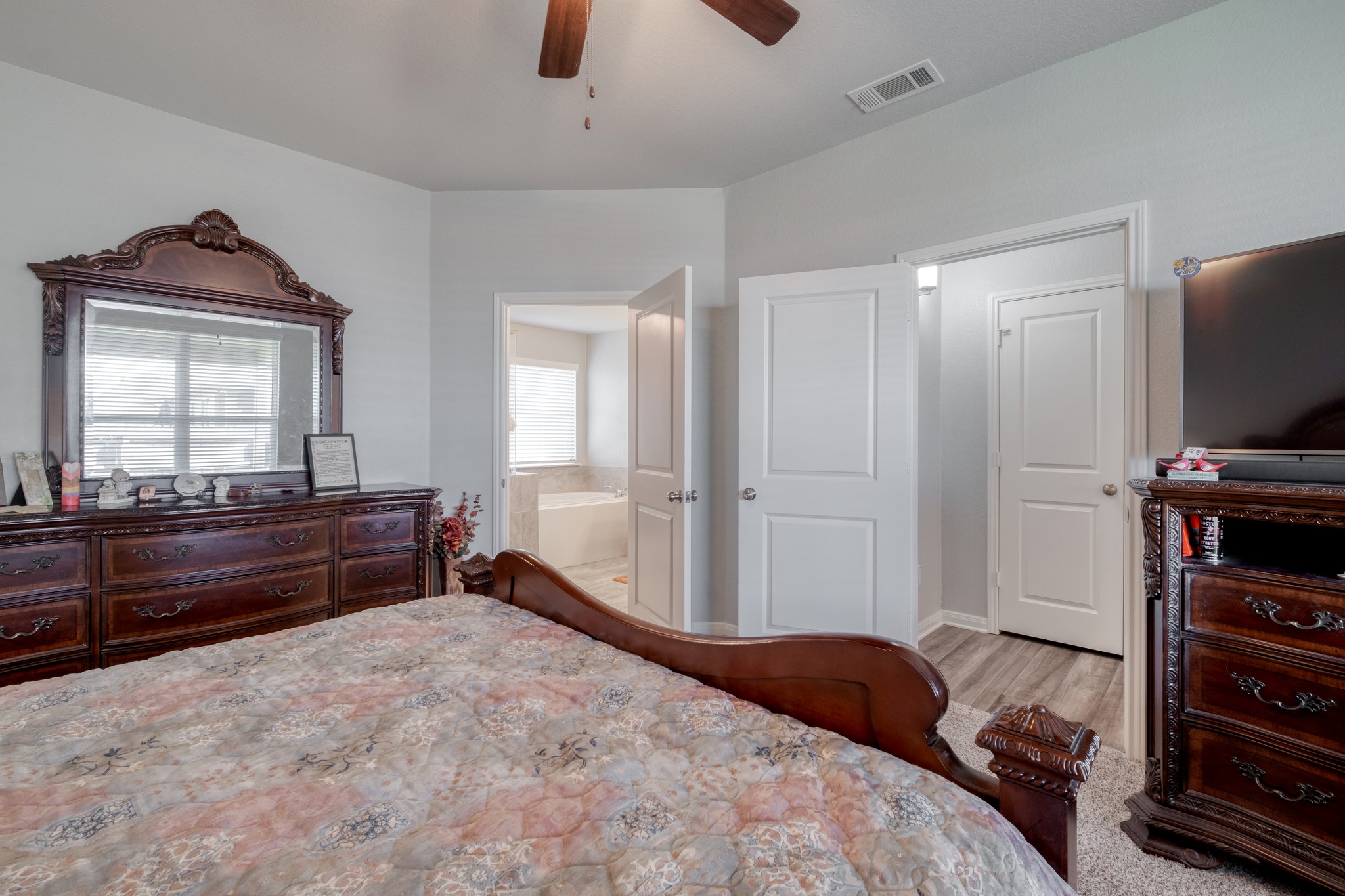 3500 Beutel Road Lorena, TX 76655 - Photo 17 of 27 Bedroom with a ceiling fan and ensuite bathroom