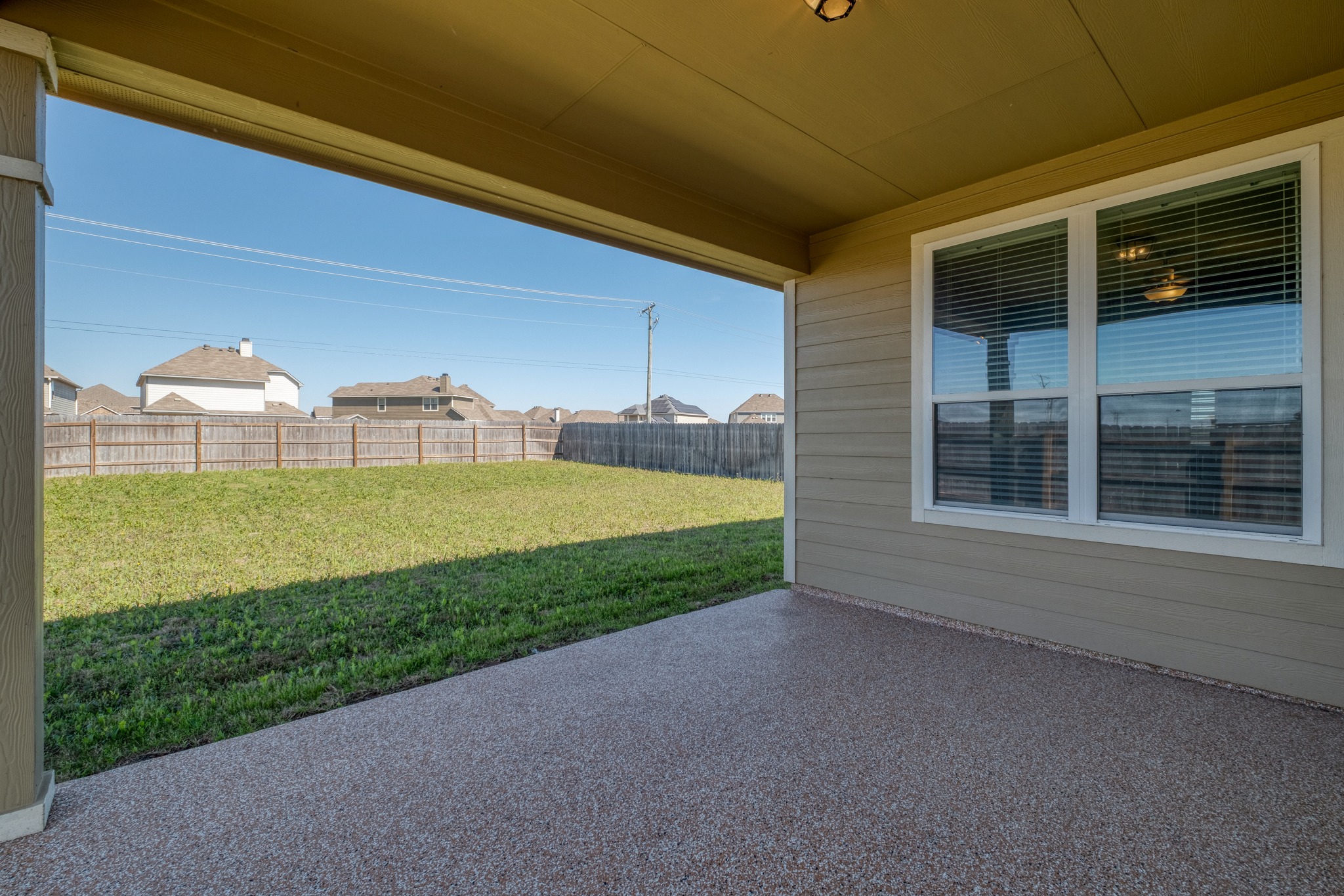 3500 Beutel Road Lorena, TX 76655 - Photo 23 of 27 Fenced backyard with a residential view and a patio area