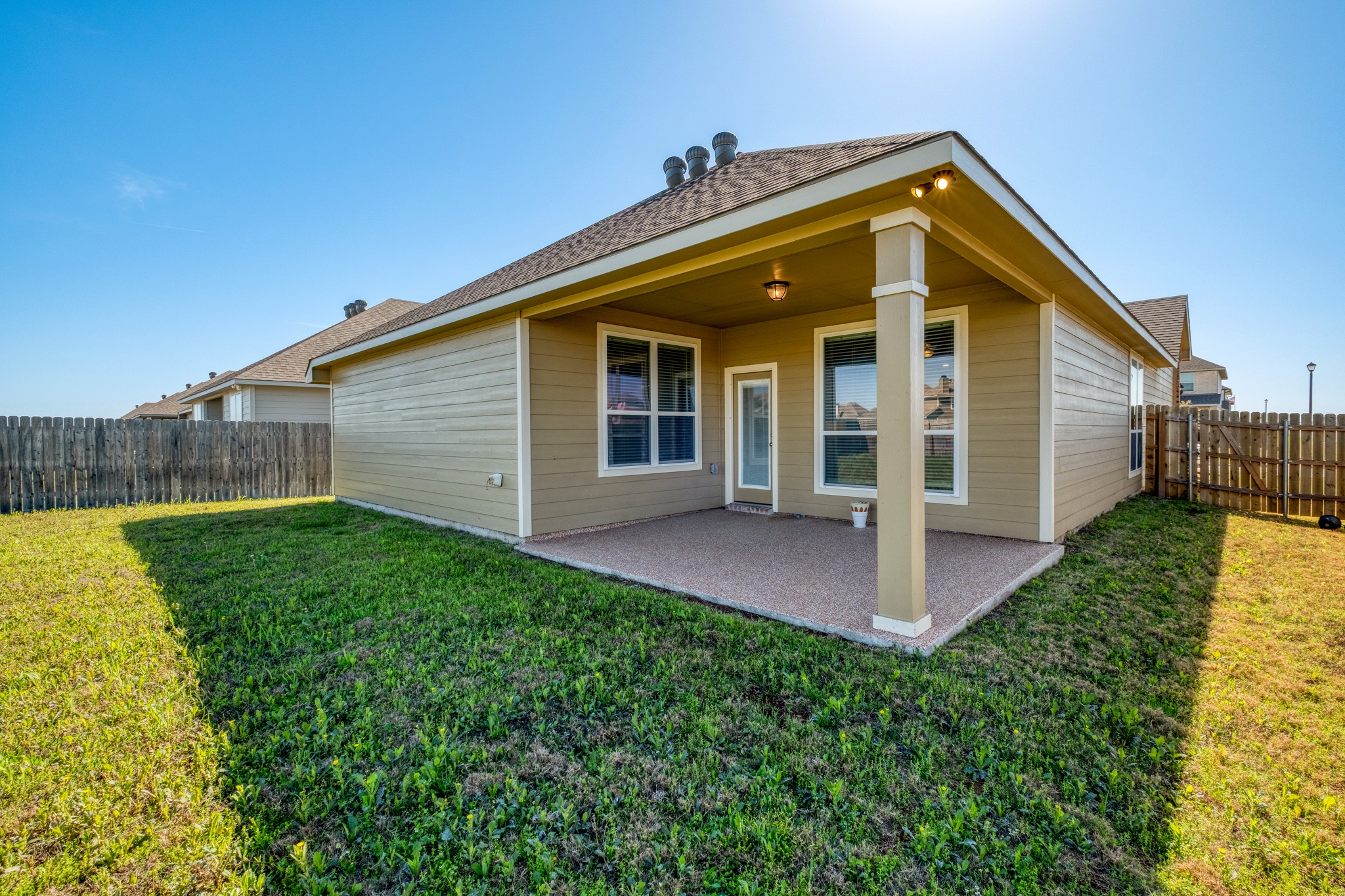 3500 Beutel Road Lorena, TX 76655 - Photo 24 of 27 Back of property with a fenced backyard and a patio area