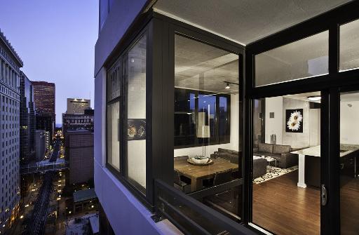 235 West Van Buren Street, Unit 2801 Chicago, IL 60607 - Photo 6 of 11 a hallway with a dining table and chairs in it