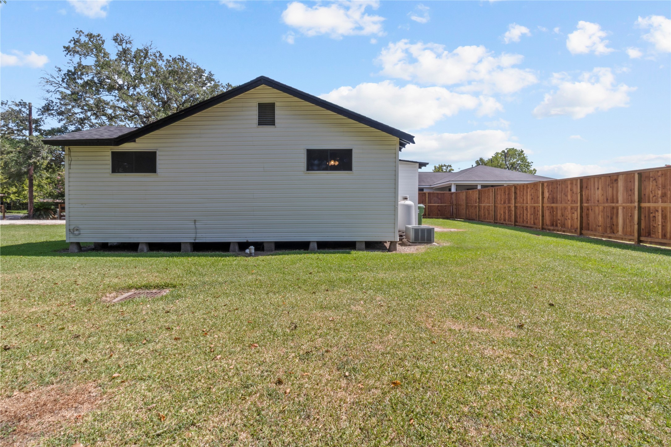 802 Collins Street Dayton, TX 77535 - Photo 10 of 12 a bathroom with a sink and a yard