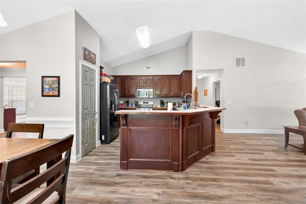 89 Katie Spring Lane Jefferson, GA 30549 - Photo 13 of 63 a room with a sink cabinets and wooden floor
