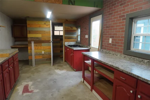 a kitchen with stainless steel appliances granite countertop a stove and a sink