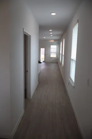 a view of hallway with windows