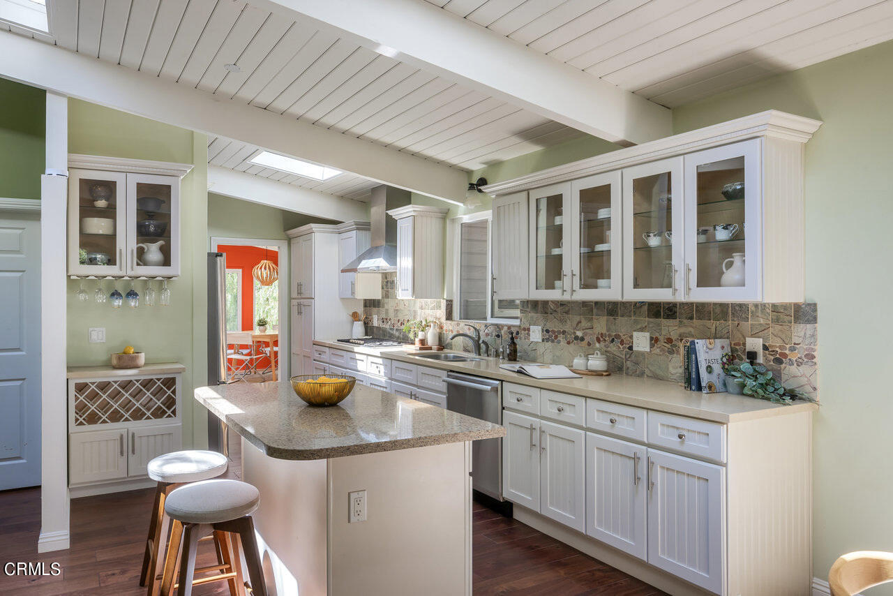 1453 Wicks Road Pasadena, CA 91103 - Photo 11 of 31 a kitchen with a sink stove and cabinets