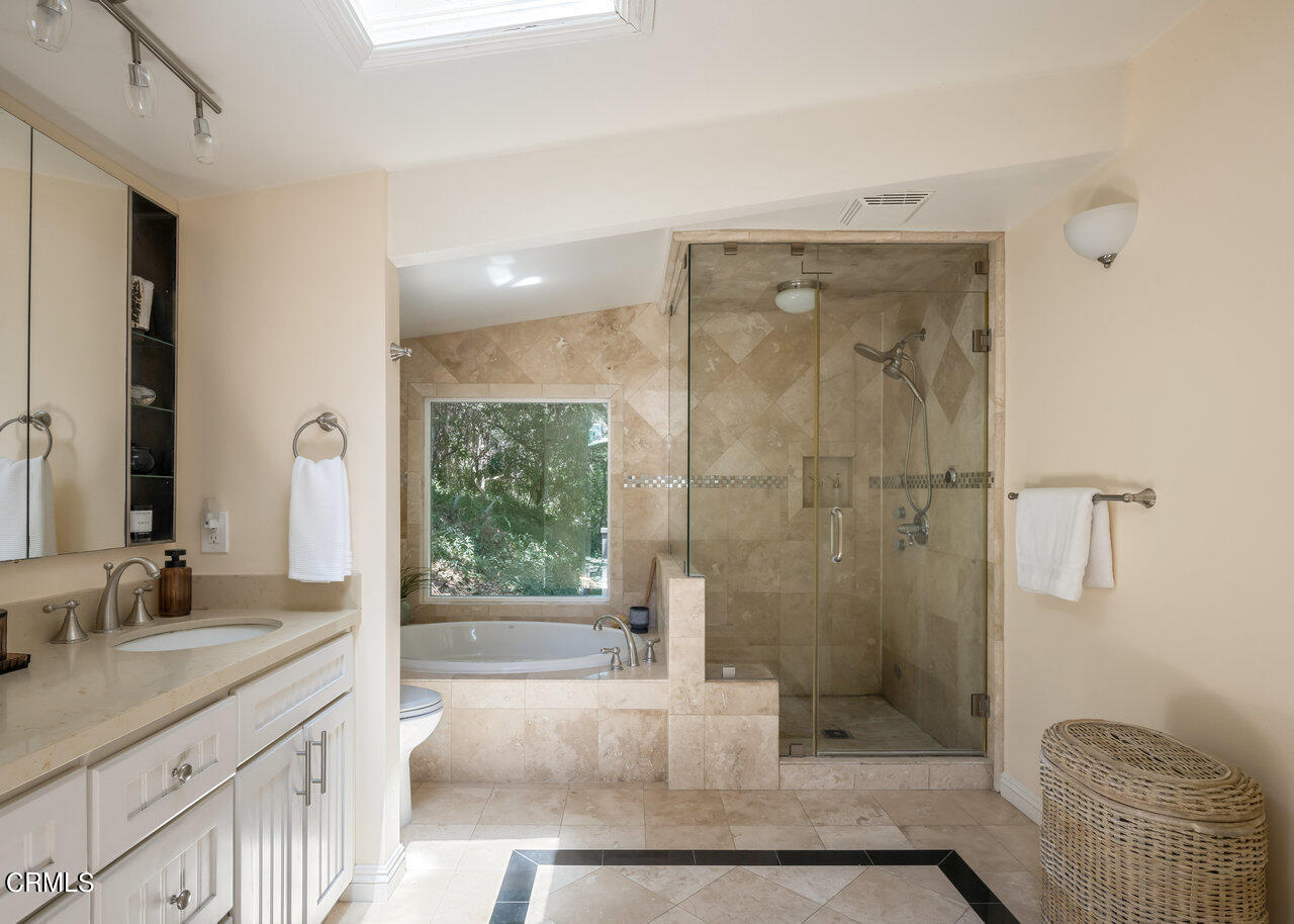 1453 Wicks Road Pasadena, CA 91103 - Photo 20 of 31 a bathroom with a granite countertop sink a toilet and shower