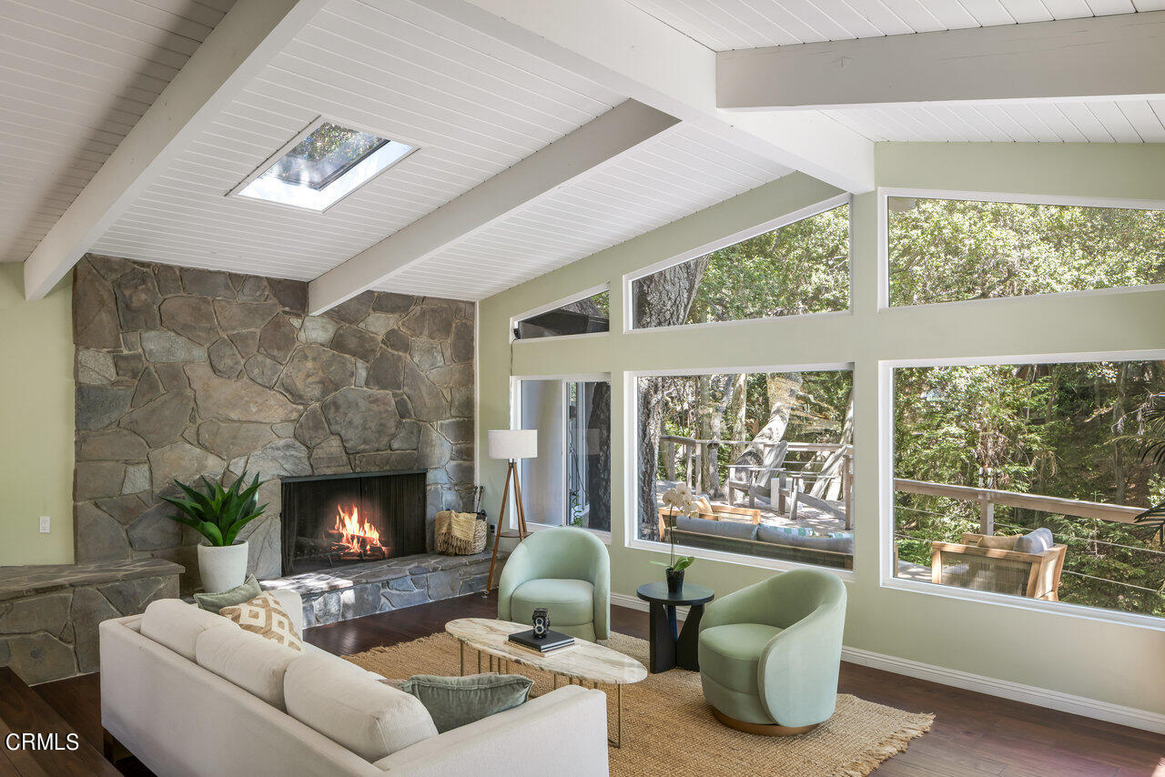 1453 Wicks Road Pasadena, CA 91103 - Photo 3 of 31 a living room with furniture a large window and a fireplace