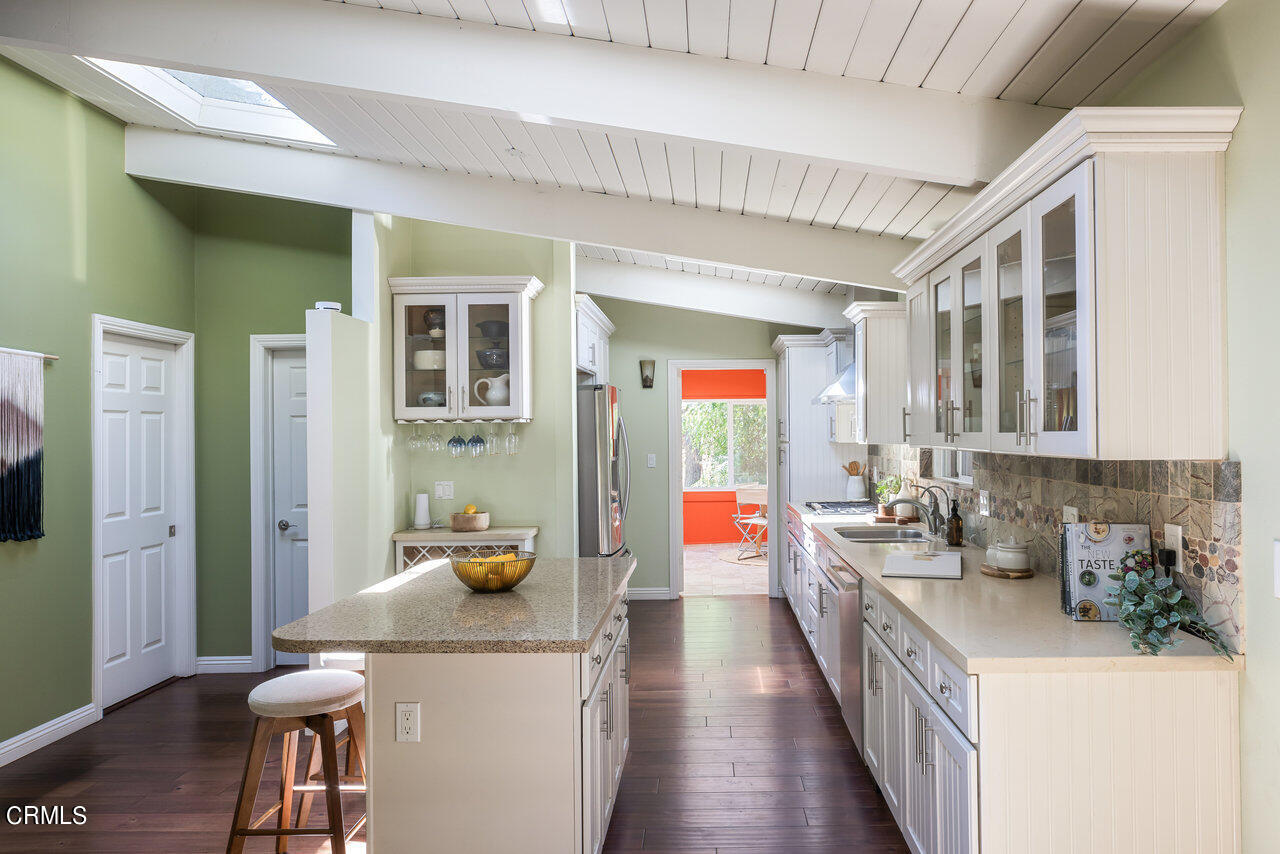 1453 Wicks Road Pasadena, CA 91103 - Photo 10 of 31 a kitchen with a sink stove and cabinets