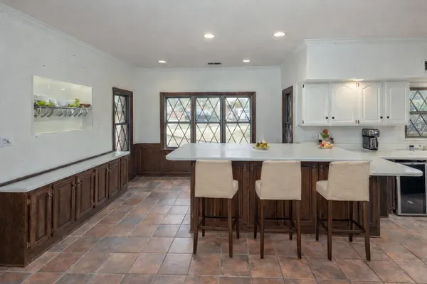 a kitchen with stainless steel appliances granite countertop a stove microwave and sink