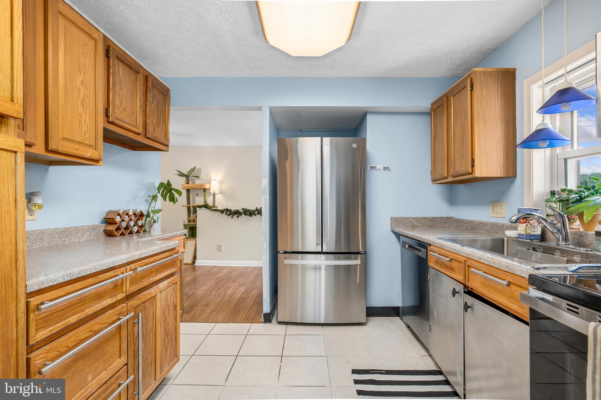 11216 Tippett Road Clinton, MD 20735 - Photo 12 of 26 a kitchen with stainless steel appliances granite countertop a refrigerator a stove and a sink