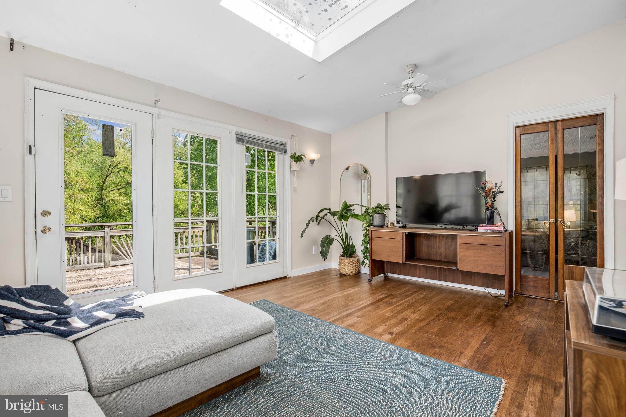 11216 Tippett Road Clinton, MD 20735 - Photo 15 of 26 a living room with furniture and a flat screen tv