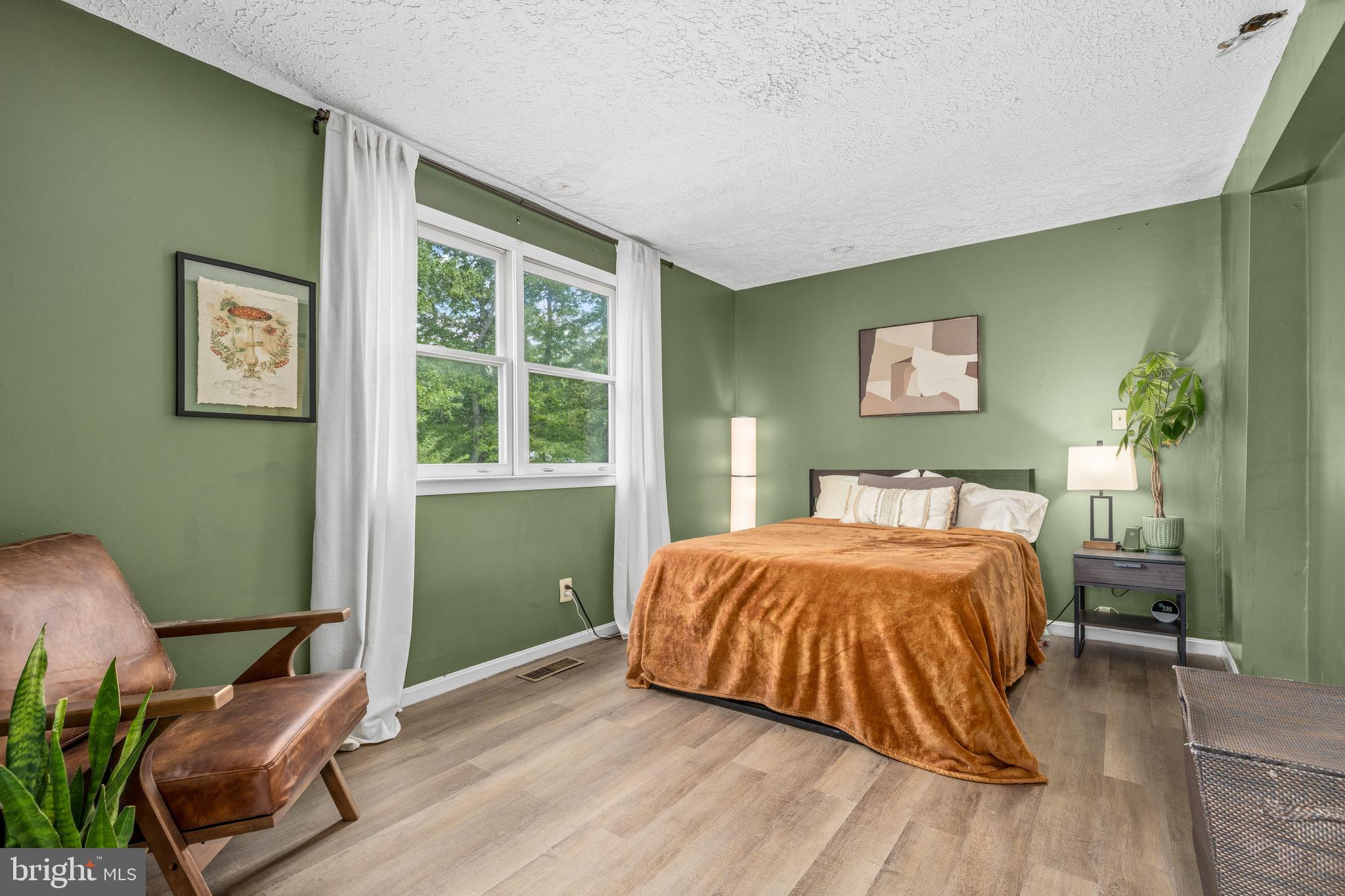 11216 Tippett Road Clinton, MD 20735 - Photo 16 of 26 a bedroom with a bed and a window