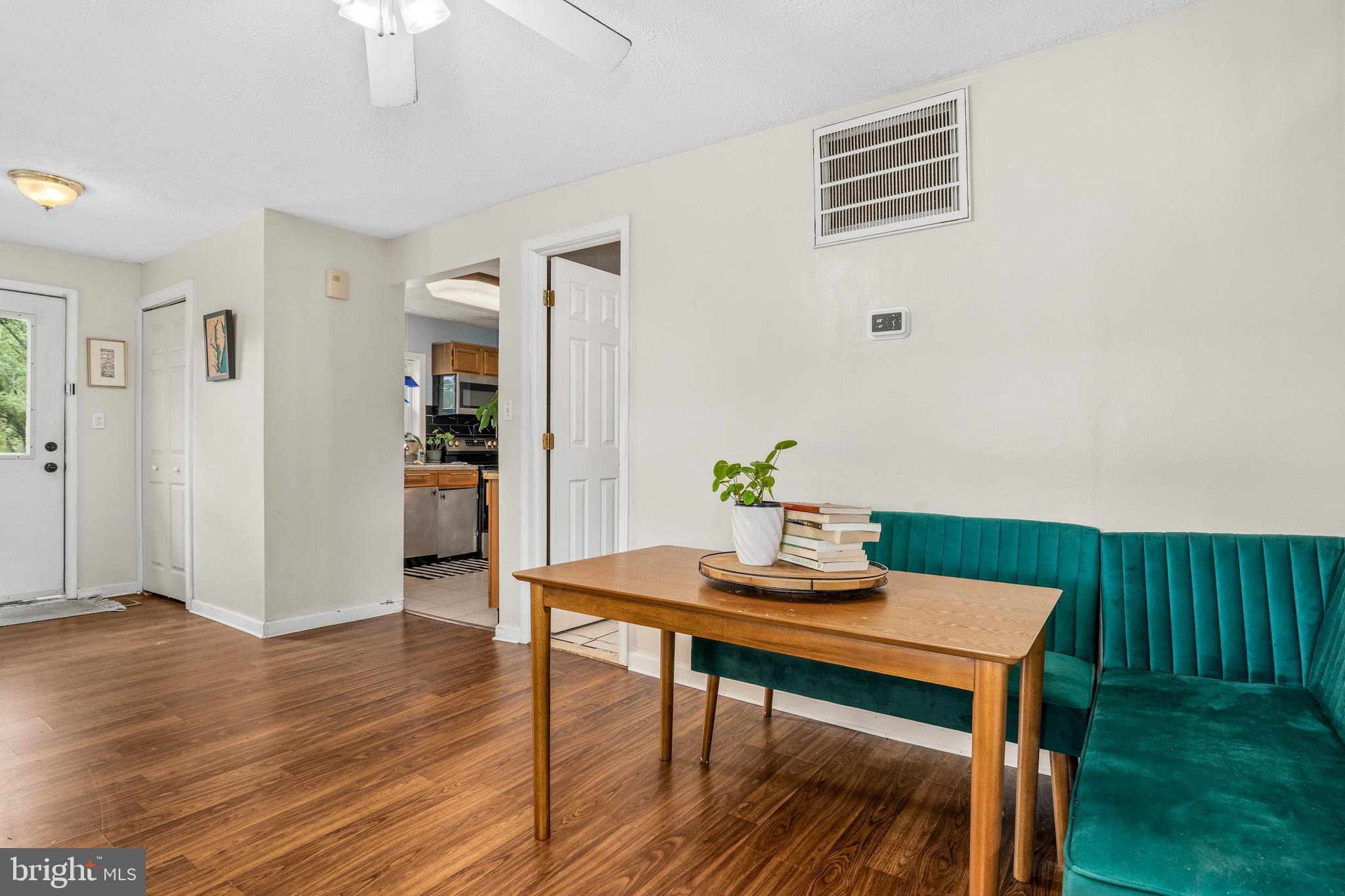 11216 Tippett Road Clinton, MD 20735 - Photo 7 of 26 a view of a dining room with furniture and wooden floor