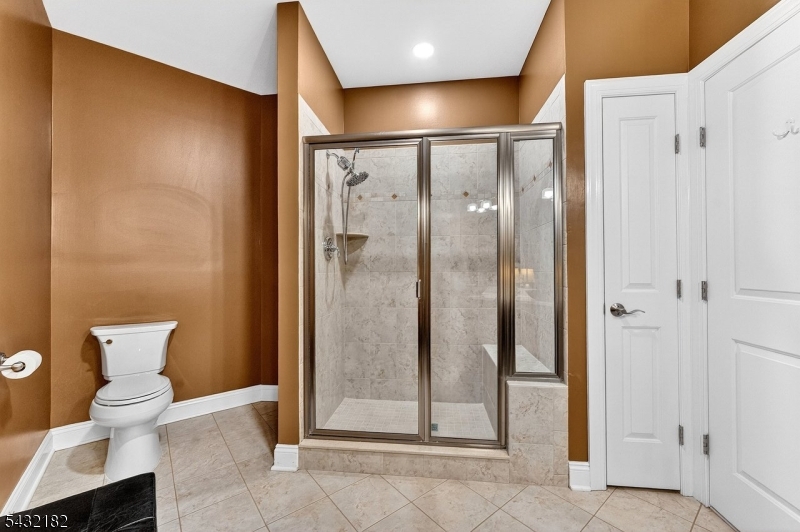 119 River Road Somerville, NJ 08876 - Photo 22 of 30 a bathroom with a glass shower door