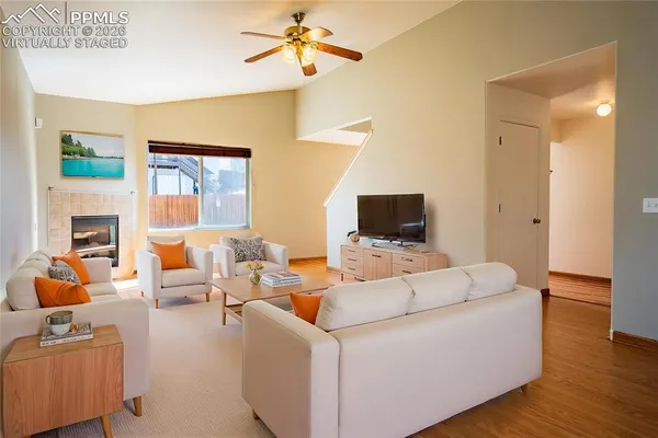 a living room with furniture and a flat screen tv