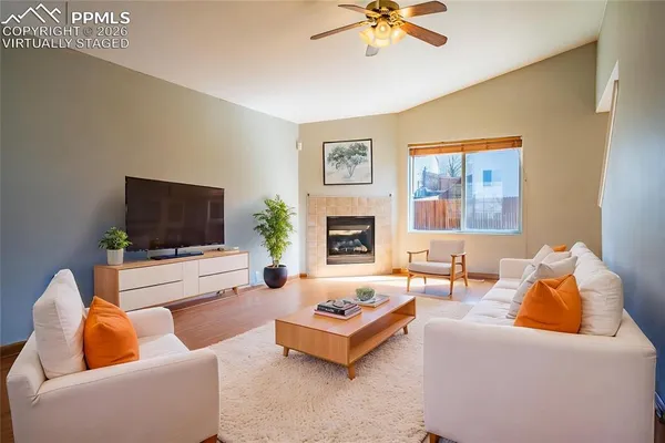 a living room with furniture and a flat screen tv