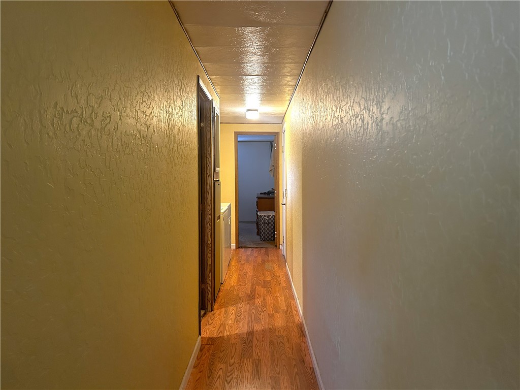 120 Thunderhead 1 Needles, CA 92363 - Photo 6 of 10 a view of a hallway with wooden floor and a bathroom