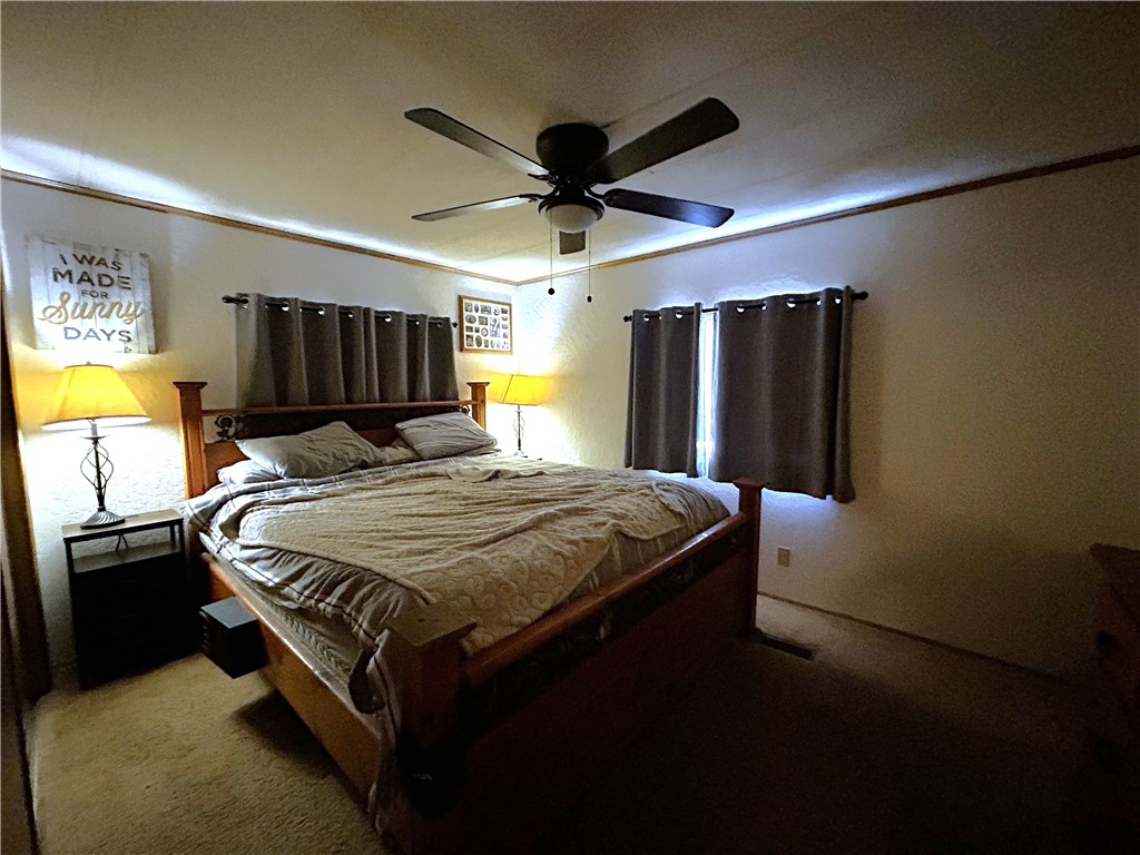 120 Thunderhead 1 Needles, CA 92363 - Photo 10 of 10 a bed sitting in a bedroom next to a window and a flat screen tv