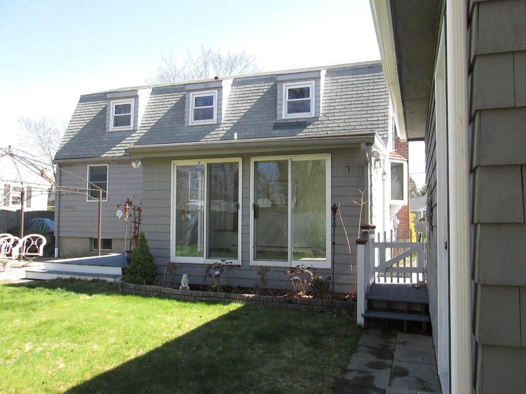 41 Millbrook Road Beverly, MA 01915 - Photo 16 of 20 a view of a house with backyard porch and sitting area