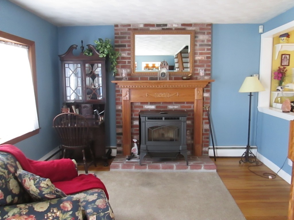 41 Millbrook Road Beverly, MA 01915 - Photo 3 of 20 a living room with furniture and a fireplace