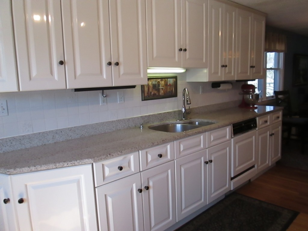 41 Millbrook Road Beverly, MA 01915 - Photo 4 of 20 a kitchen with granite countertop white cabinets and sink