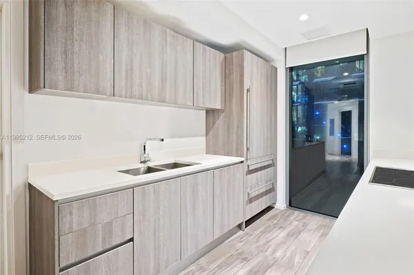 a kitchen with a sink and cabinets