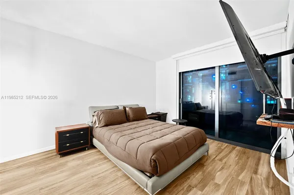 a bedroom with a bed and walk in closet