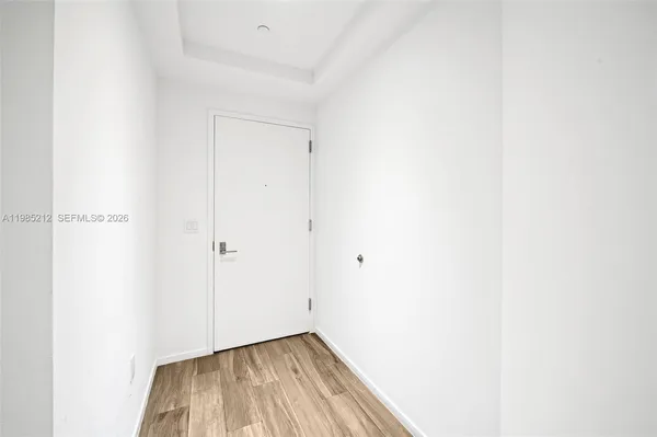 a view of a small space with wooden floor