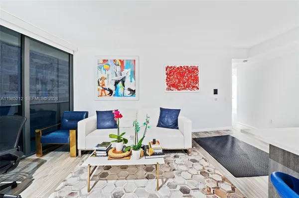 a living room with furniture and rug