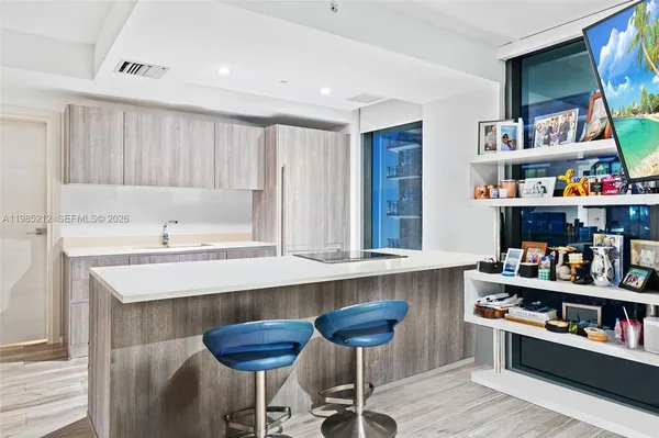 a kitchen with a dining table and chairs