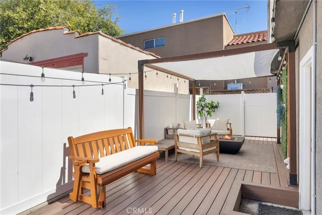 a view of a wooden chairs on the deck