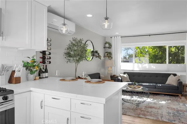 a bathroom with a granite countertop sink and a large mirror