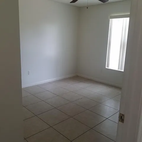 an empty room with a empty space and a window