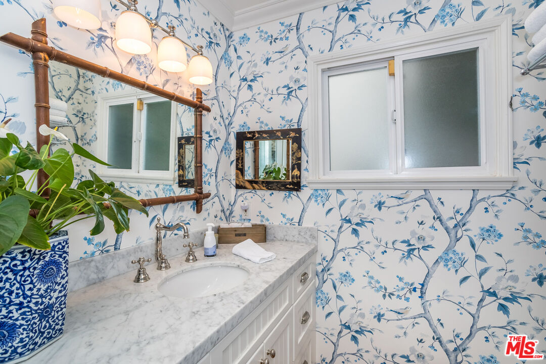 31658 Broad Beach Road Malibu, CA 90265 - Photo 27 of 50 a bathroom with a granite countertop sink and a mirror
