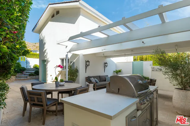 a outdoor space with table and chairs