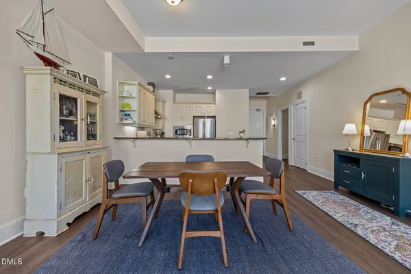 a view of a dining room with furniture and wooden floor