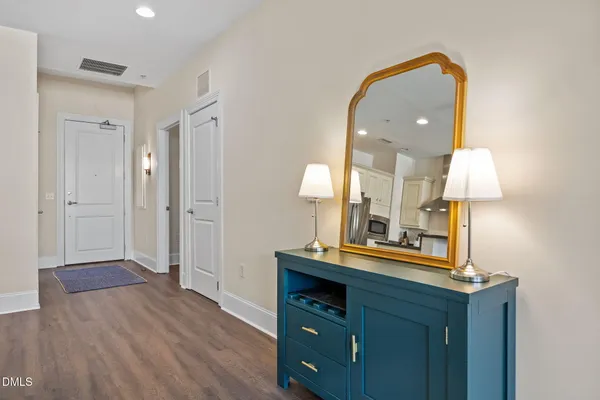a view of a bathroom with a sink mirror and shower