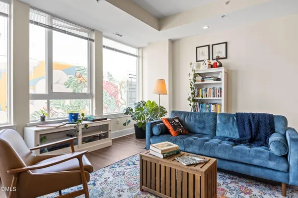 a living room with furniture and a large window