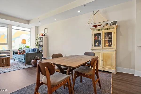 a dining room with furniture and window