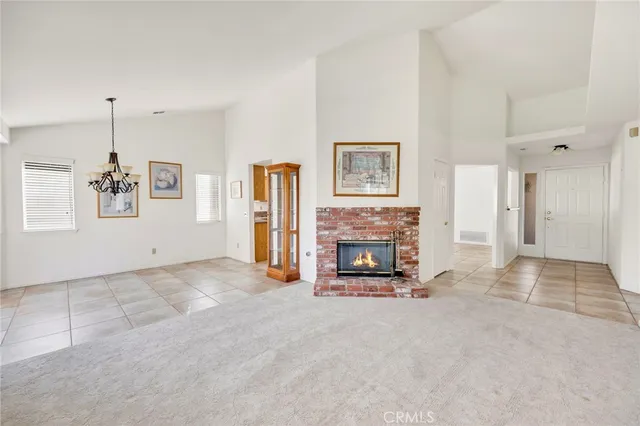 a view of an empty room with a fireplace