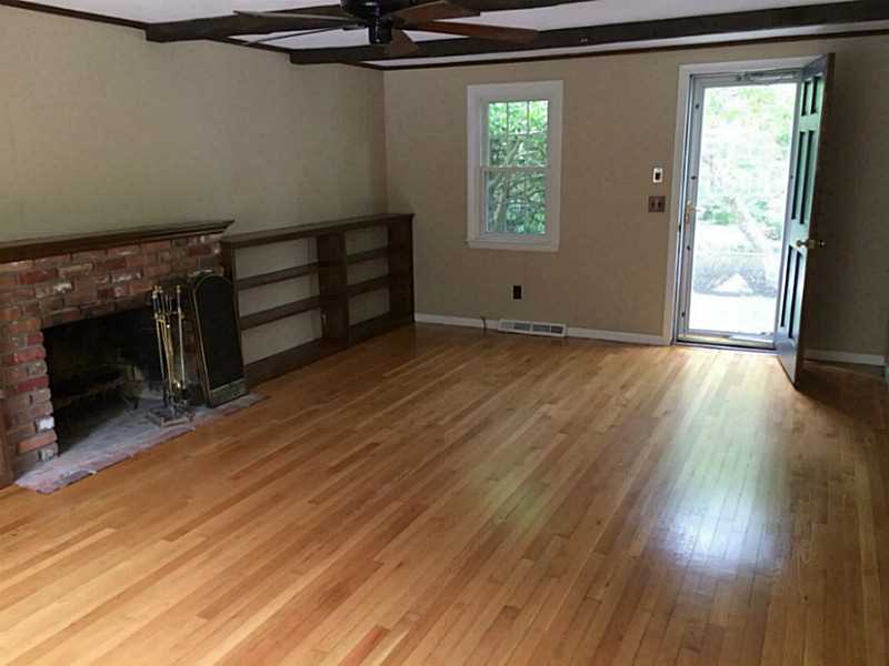 596 Potter Road North Kingstown, RI 02852 - Photo 2 of 22 Den/Family/Great Room. Wood burning fireplace with refinished hardwoods throughout the home.