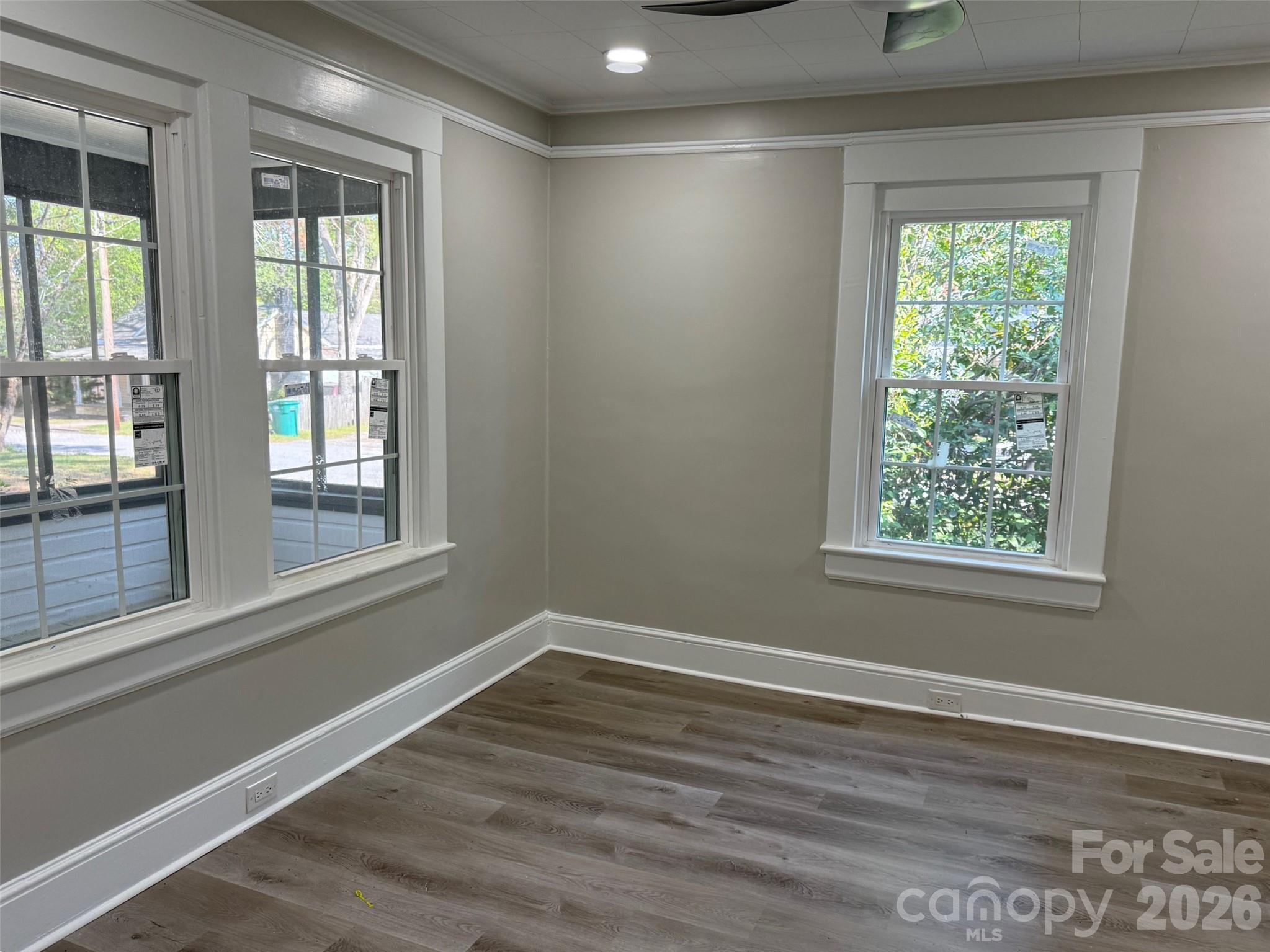 161 Seaboard Street Cheraw, SC 29520 - Photo 11 of 15 a view of empty room with wooden floor and fan