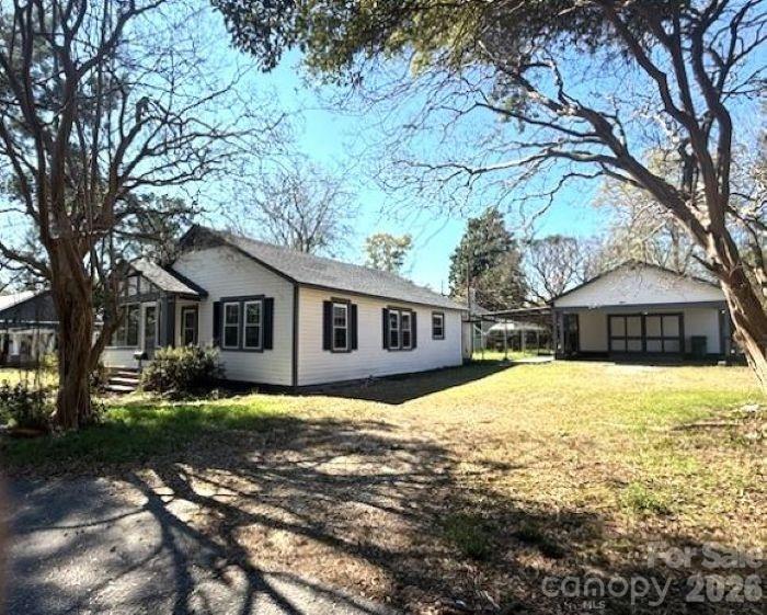 161 Seaboard Street Cheraw, SC 29520 - Photo 3 of 15 a front view of a house with yard and trees