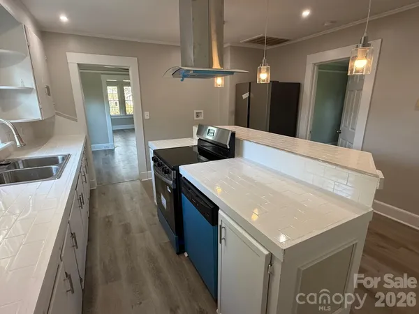 a kitchen with a sink and wooden cabinets