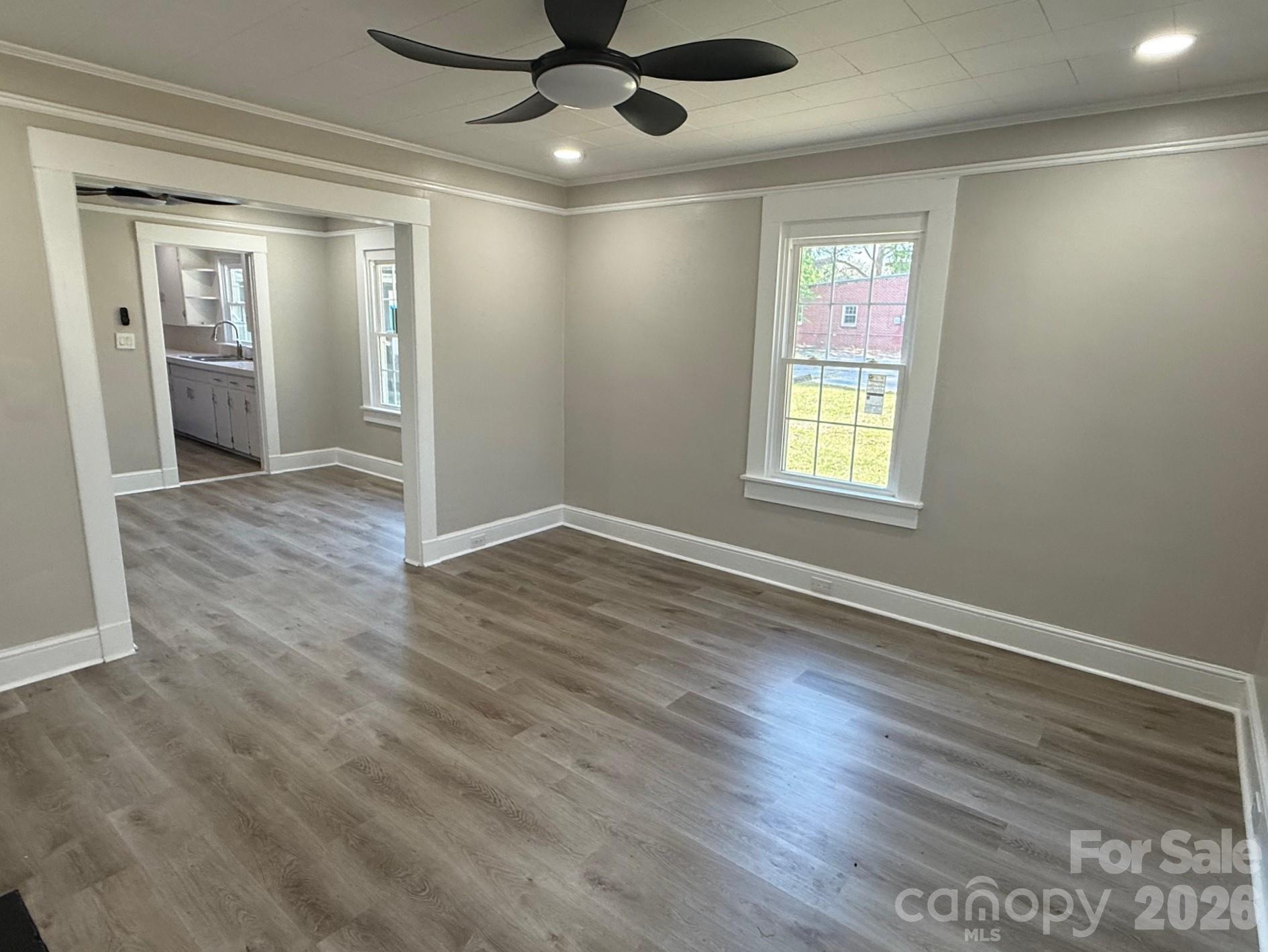 161 Seaboard Street Cheraw, SC 29520 - Photo 10 of 15 a view of an empty room with wooden floor and a window