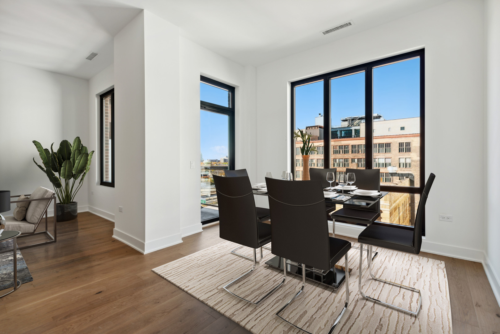 323 South Racine Avenue, Unit 6B Chicago, IL 60607 - Photo 6 of 25 a dining room with wooden floor a glass table and chairs